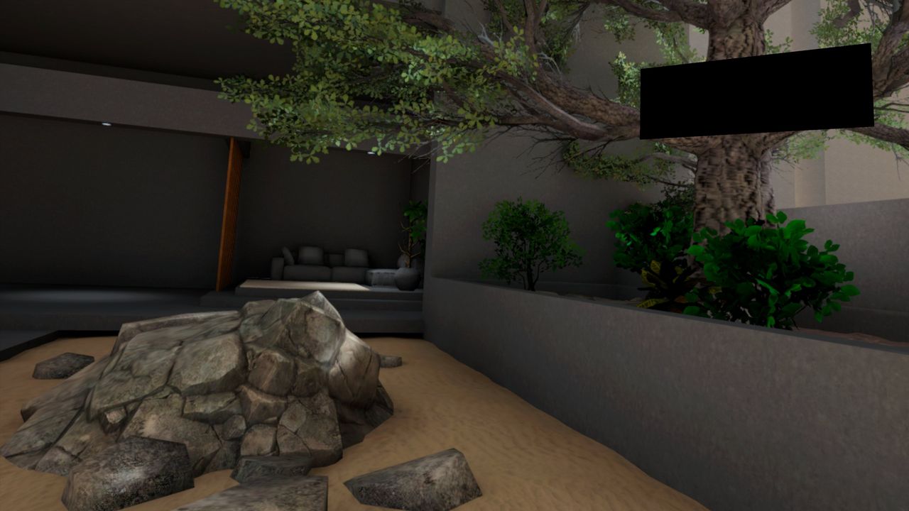 Shaded lounge overlooking sand and rocks